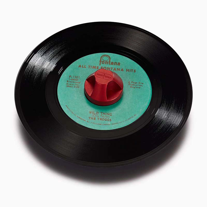 Seven inch vinyl record green label red 45 adapter