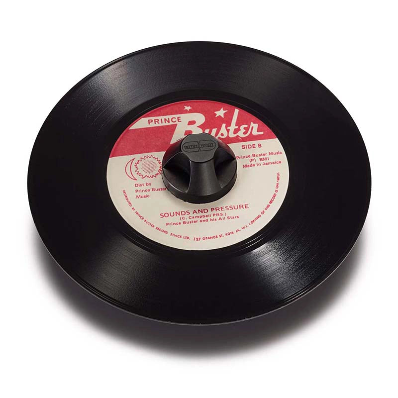 Seven inch vinyl record red white label black 45 adapter