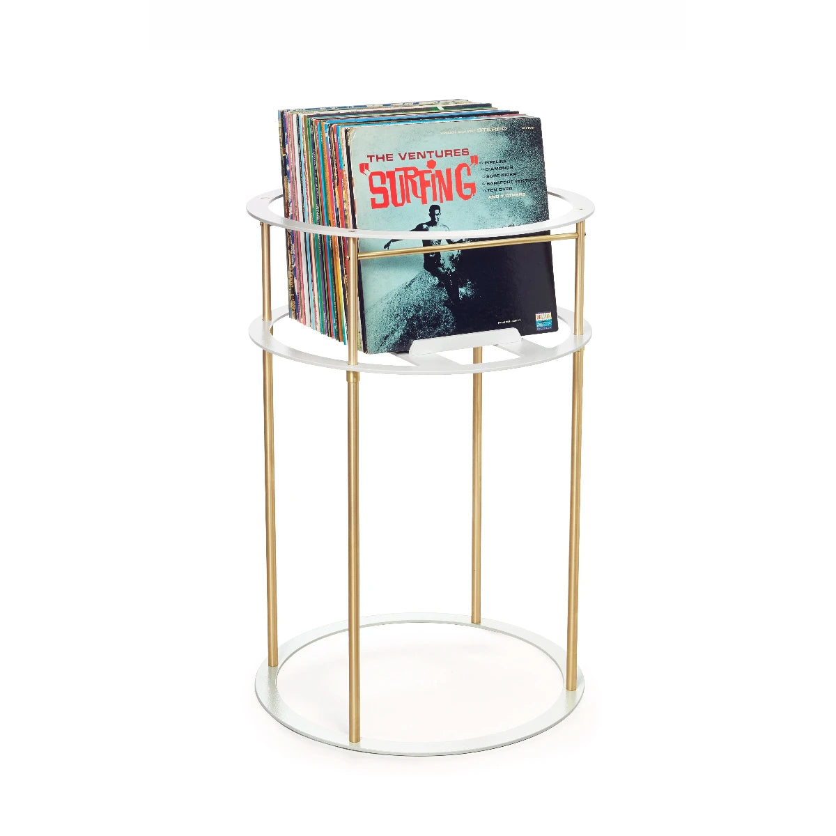 Stack of vinyl records with blue album cover facing forward inside a curcular white and brass metal pedestal