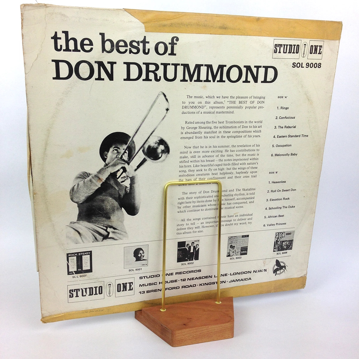 Vintage ska reggae album displayed on a wood and brass stand