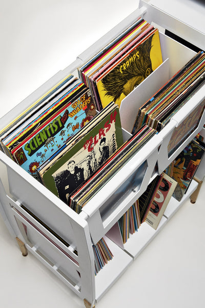 View looking down at vinyl record albums that are flipped at different angles